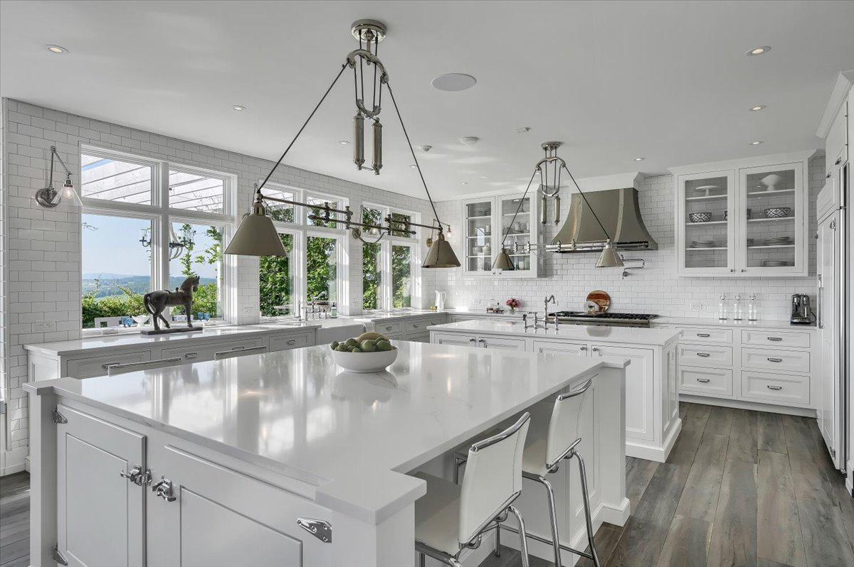 Professional chefs kitchen at The Westtown Reset — marble island, professional ovens, valley views