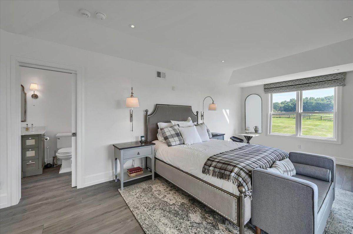 Guest bedroom at The Westtown Reset — en-suite bathroom, lawn and paddock views, luxury upstate NY